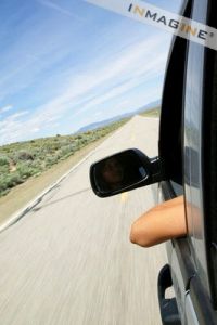 Arm out car window on highway